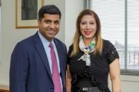 Fatemeh Momen-Heravi and Mathew Matthen standing in front of a window